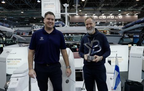 YachtBuyer trophy handover between Jack Haines and Jan-Erik Viitala, Axopar Founding Partner / Creative & Innovation Director 