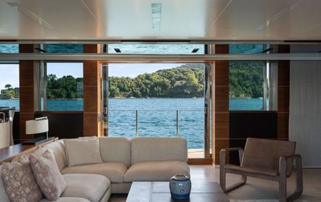 Superyacht Lady A for Sale saloon view out of the terraces and across lounge