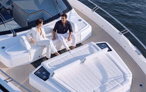 Couple on Galeon 570 SKY Motor Yacht foredeck seating