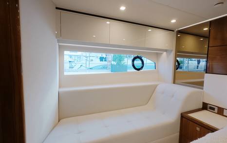 Riviera 5600 Sport Platinum Edition owner's cabin chaise lounge and hull window