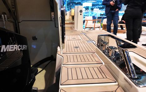 Starboard side deck on the Aiata Sunfinder 50 with teak-style flooring and stainless steel mooring gear
