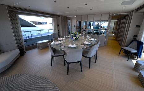 Benetti Oasis 34M formal dining area within the main deck saloon, showing the yacht's open-plan interior layout.