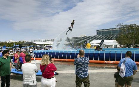 Flyboarding demonstration with spectators in the foreground