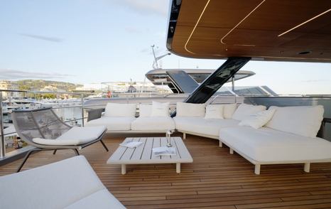 Sunreef Ultima 88 aft flybridge lounge with freestanding sofas and low table
