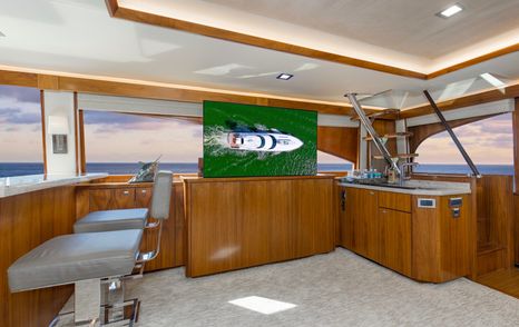 Viking 92EB Sportsfisher yacht Touche saloon with pop up TV and bar area 