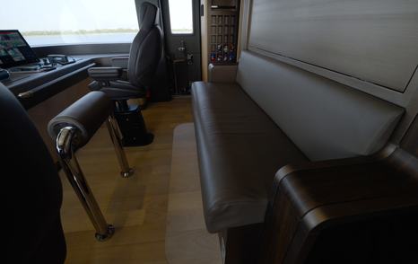 Observer bench seating behind the helm in the Gulf Craft Majesty 145 wheelhouse