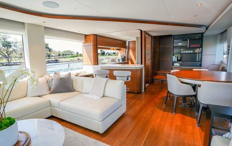 Princess motor yacht Record Year main saloon with dining area and galley 