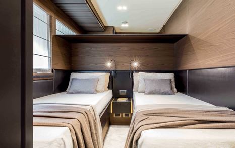 Twin cabins on a Ferretti 670 yacht