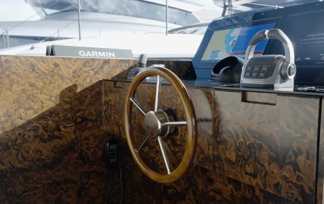Sanlorenzo SHE helm wheel set into the burr-wood dashboard