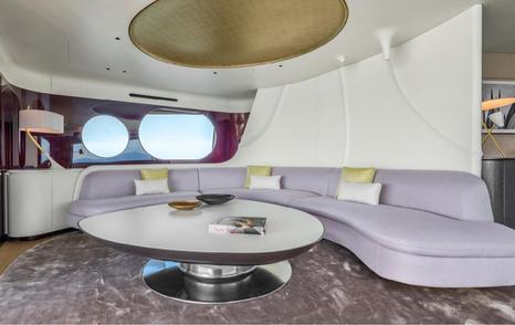 Azimut Grande Trideck Superyacht Blue Eyes skylounge with curved purple sofa and carpet