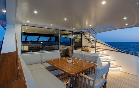 Mulder Favorite 2200 motor yacht aft deck with aflresco dining and L-shaped sofa 