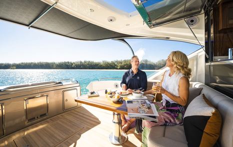 Riviera-6000-Sport-Yacht-Platinum-Edition-Review-aft-cockpit-dining-area-lifestyle