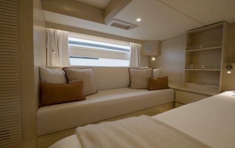 Delta-Powerboats-72-Review-owner-cabin-sofa