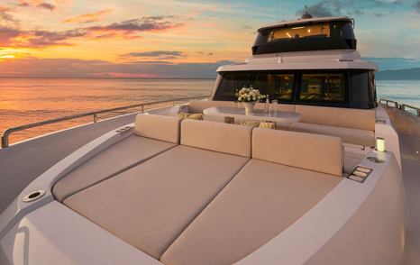 Horizon V77S Hull 13 motor yacht foredeck with large beige sunpads 