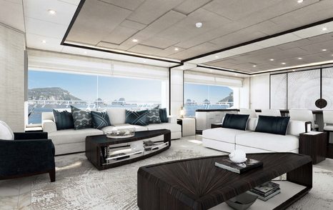 rendering of the main salon with white sofas, black cushions, a black coffee table and light silver carpets on board the Gulf 120 