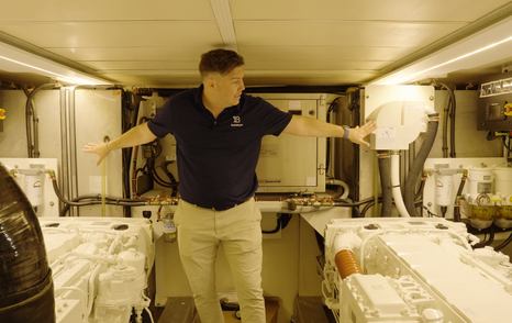 Beneteau Grand Trawler 63 engine room offering full standing headroom between twin MAN engines