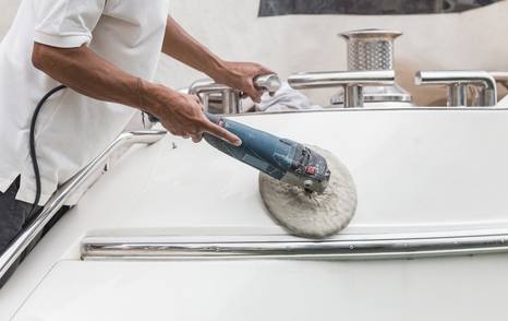 person cleaning the yacht