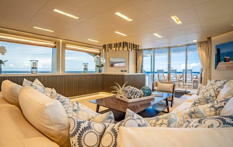 Superyacht Short Story main saloon seating area with mounted TV