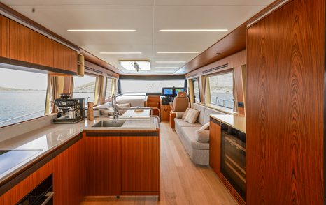 Galley on motor yacht Greenline 58 Fly with open plan layout and wood details