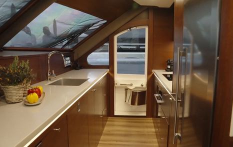 Grand-Banks-GB85-Skylounge-galley-sidedoor