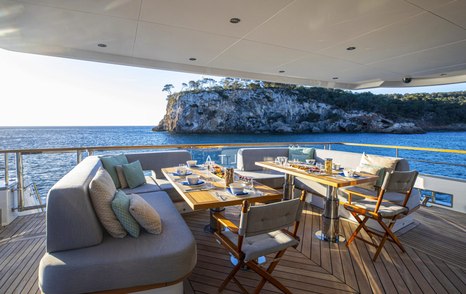 Superyacht Delta One's aft deck with alfresco dining