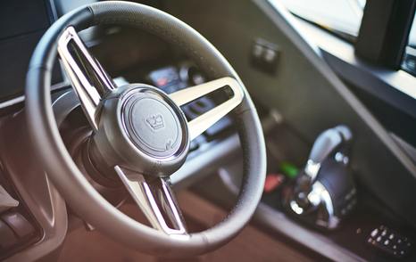 Princess V55 dished steering wheel and throttle controls at twin Volvo Penta D13 shaft-drive helm