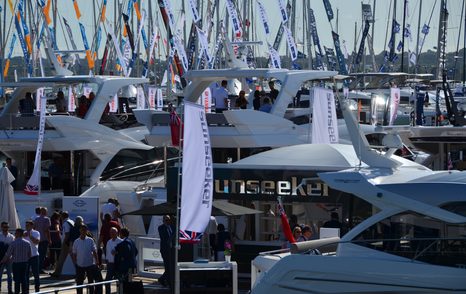 People at boat show, with a Sunseeker text visible