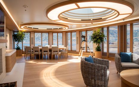 Superyacht Flying Fox interior with circular light fixture and seating