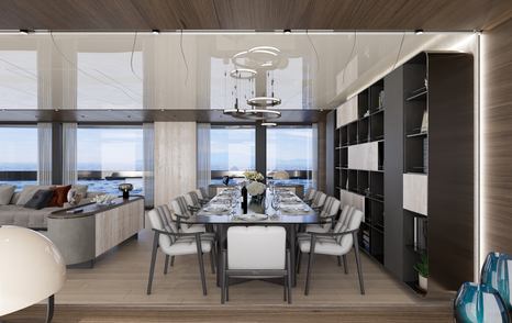 Main salon dining area on Atlantique 55 with dining table and shelving