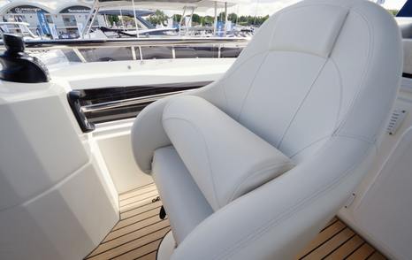 Beneteau Grand Trawler 63 adjustable flybridge helm seat with armrests and commanding driving position