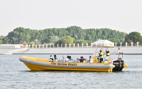 Yellow RIB tender transporting ADIBS visitors