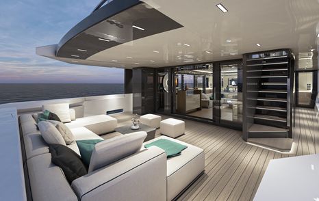 Rear view of aft exterior Arcadia A115 seating, white U shaped seating and coffee table facing glass doors and staircase