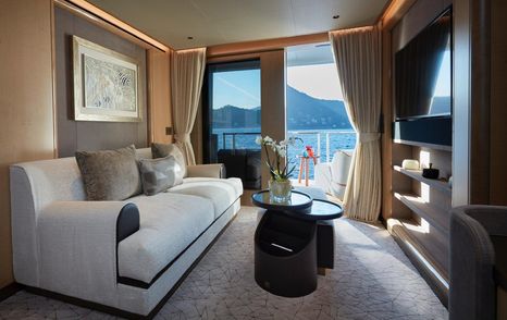 Superyacht Somnium master cabin seating area and private balcony
