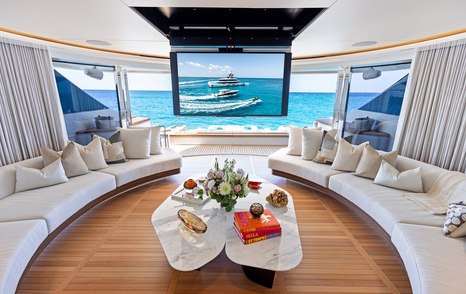Superyacht Contigo main saloon aft curved seating with fold down TV