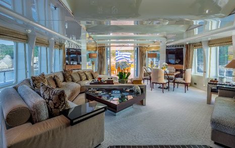 Superyacht Vera's main deck seating area with coffee table 