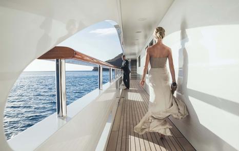 stewardess setting table for breakfast superyacht