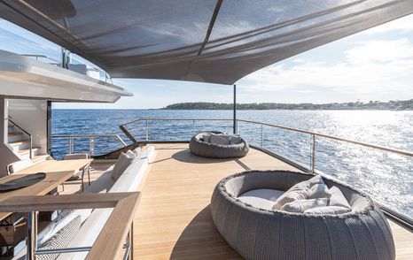 Numarine 30XP aft sunbathing area with cushions and shaded canopy 