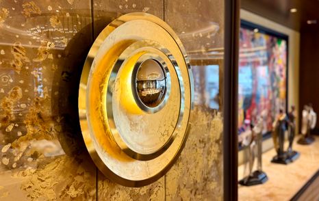 Decorative lighting feature on the wall inside the Amels 242 Casino Royale main saloon.