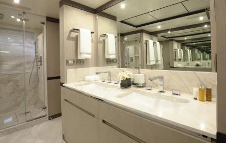 willow bathroom with glass shower and marble interior 