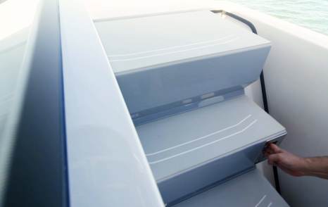 Aquila 45 Sport sliding deck steps in closed position, showing flush walkway design on foredeck