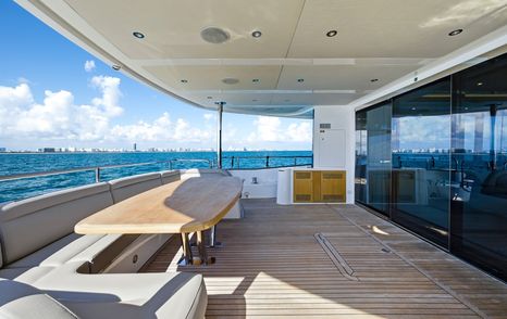 Sunseeker 95 yacht Pure Vida main aft deck U-shaped shaded seating