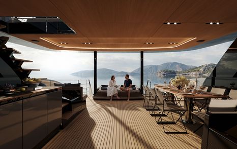 Sunreef Ultima 88 Catamaran aft deck with couple lounging on shaded seating area 