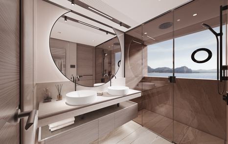 The owner's bathroom onboard the Princess X90 boasts a large round mirror and a spacious shower