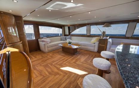 Viking 82C Sportsfisher yacht Monkey Business main salooon marbled bar area and L-shaped sofa 