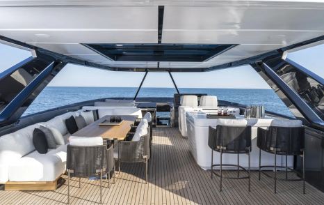 Ferretti 940 motor yacht sundeck with bar area and alfresco dining 