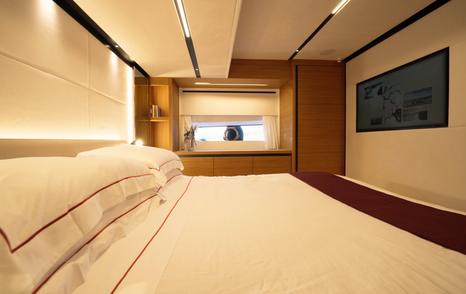 Solaris-Power-60-Coupe-Review-owners-cabin-berth-view-with-forward-bulkhead-and-TV