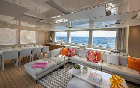 Motor yacht Xwave's main saloon L-shaped sofa