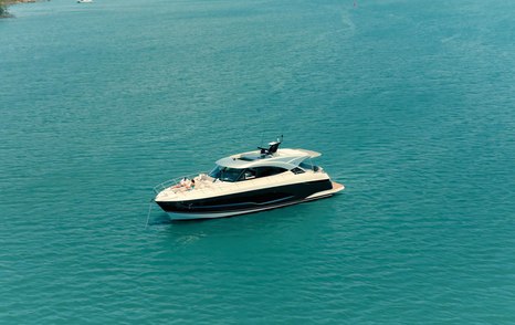 Riviera 5600 Sport Platinum Edition at anchor viewed from the port bow