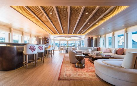 Superyacht Here Comes The Sun lounge with bar area and plush seating
