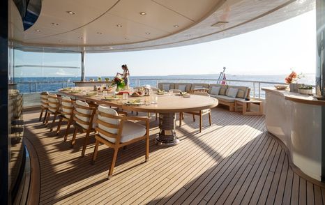 AHS aft deck with dining table and chairs